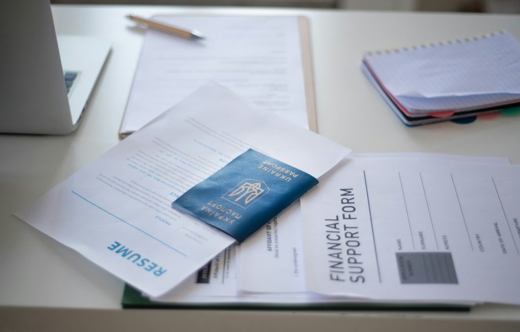 Application forms for Ukrainian refugeeson desk in asylum centre.